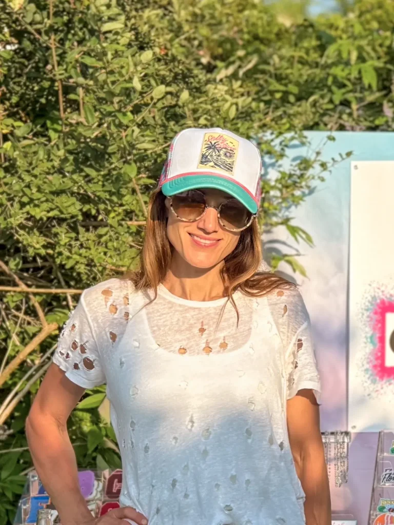 Amber Cariglio from Curated & Co, co-founder of the Hamptons and Long Island hat bar experience, bringing hands-on energy to every event.